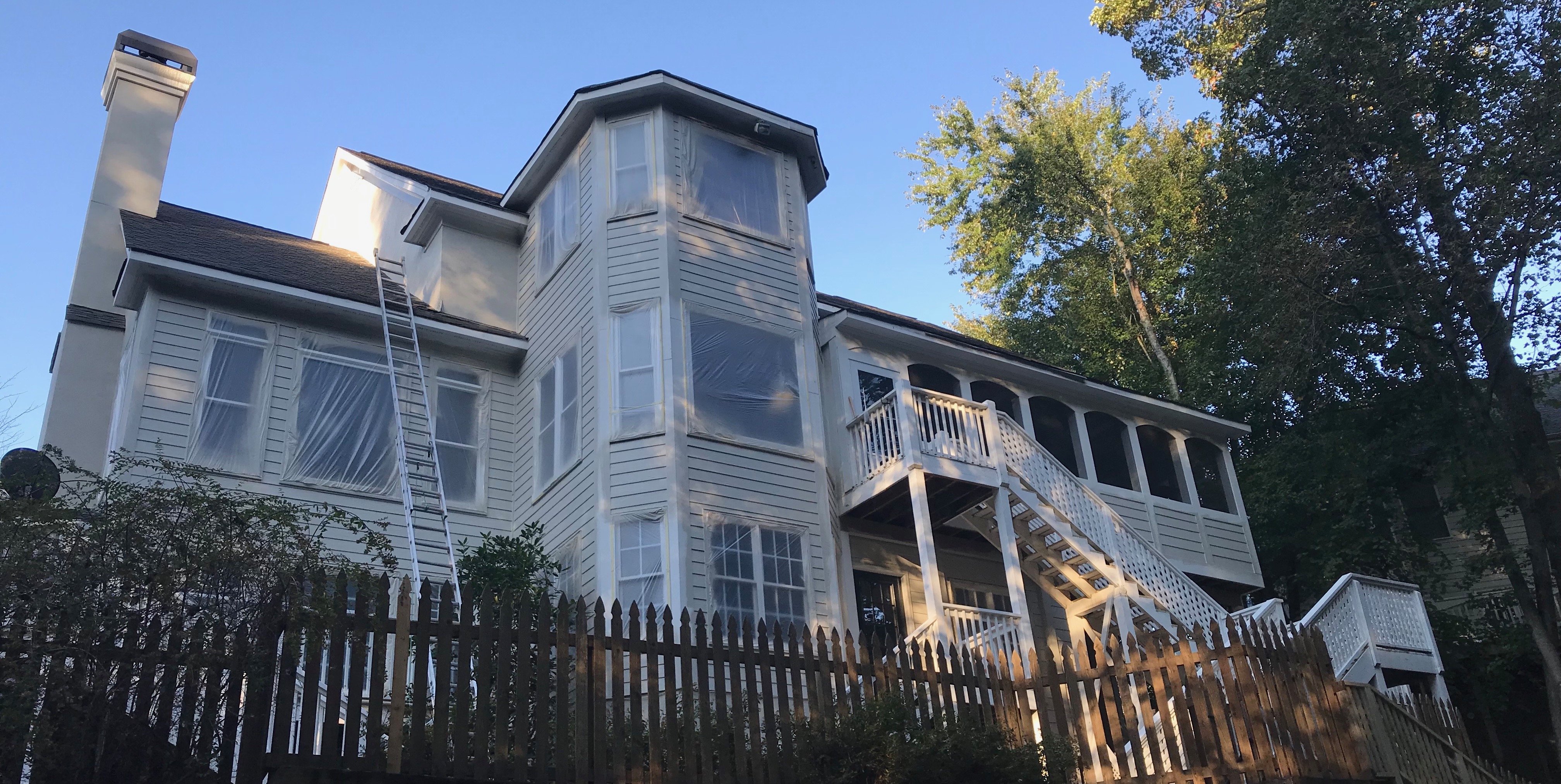 Large white house exterior painting project