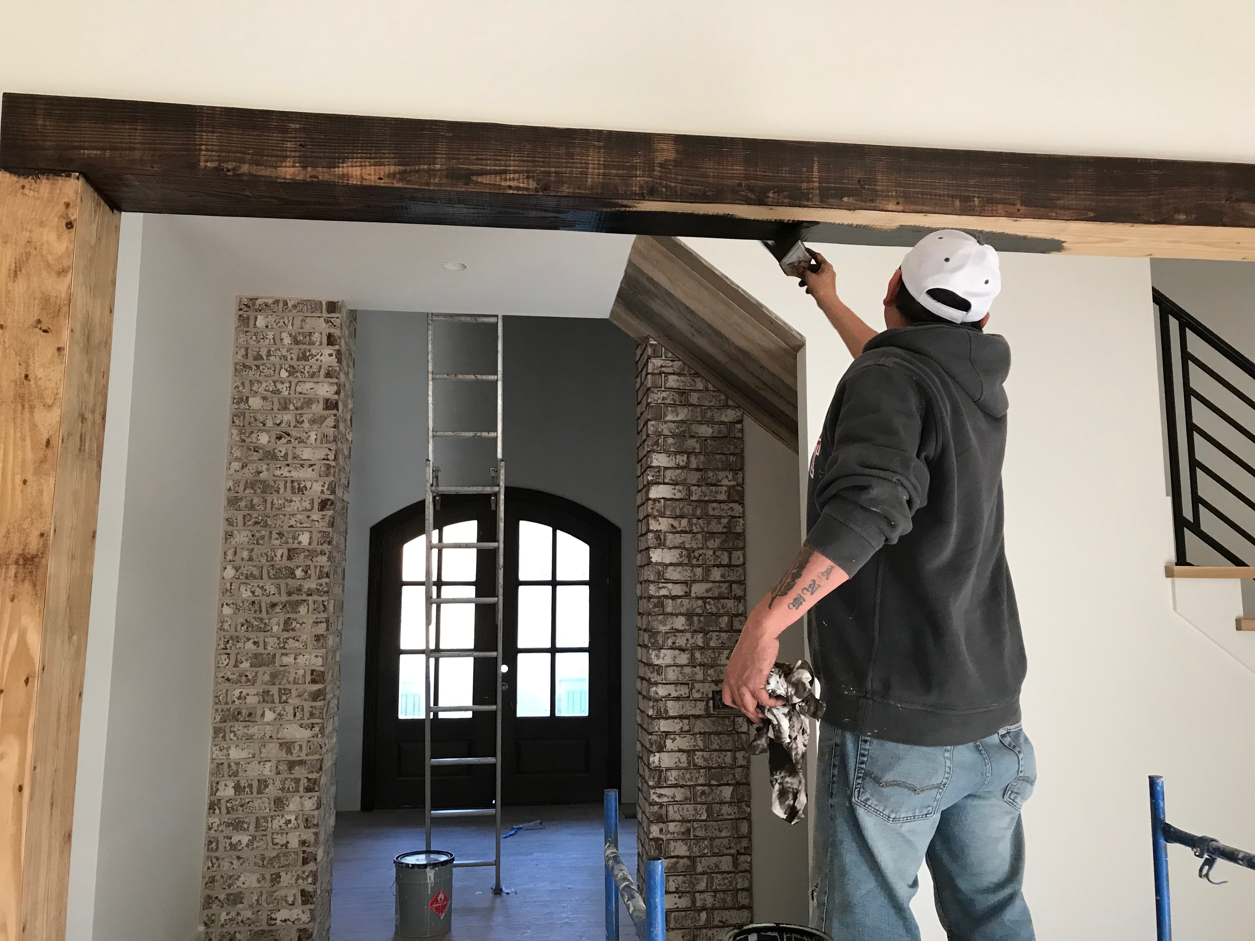 Interior wood beam staining in luxury home